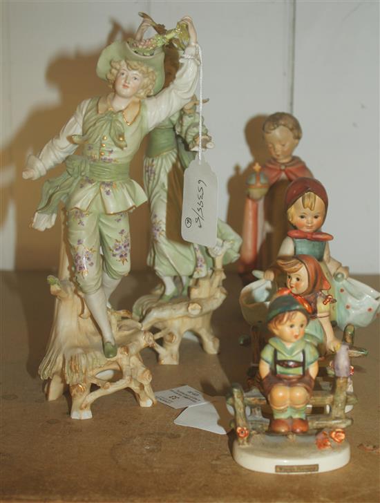 Four Hummel figures and a pair of Continental figures